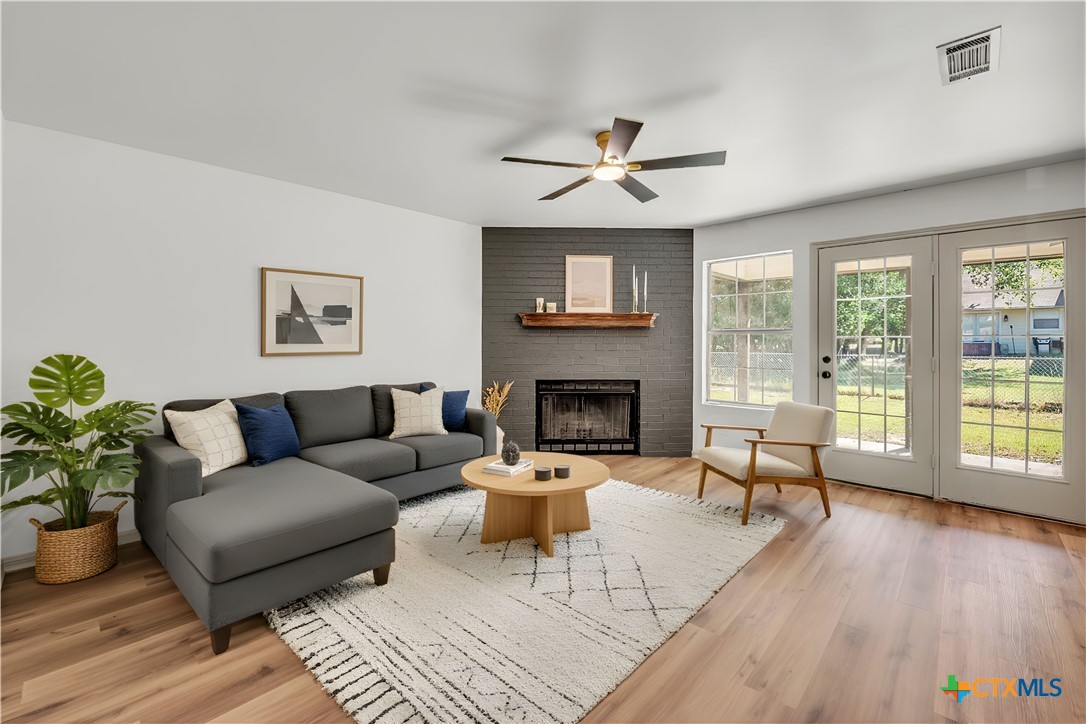 42 Great W Loop Belton, TX 76513 - Photo 6 of 29 a living room with furniture and a fireplace