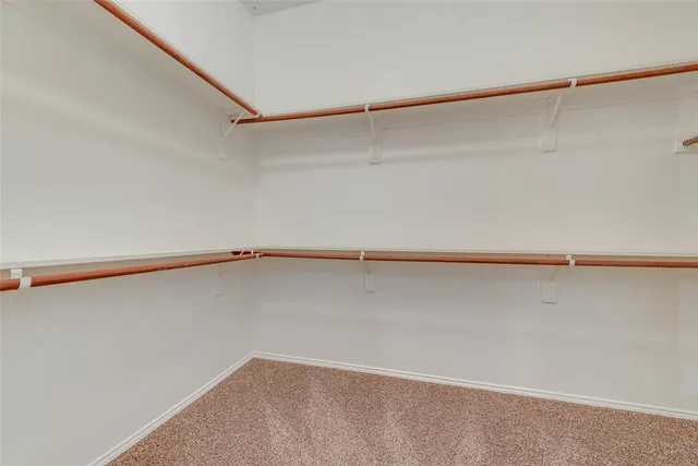 a view of a room with shelf on the wall