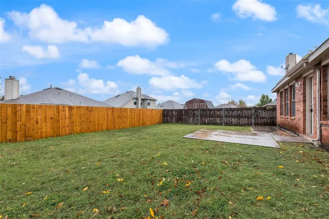 a view of a swimming pool and an outdoor seating