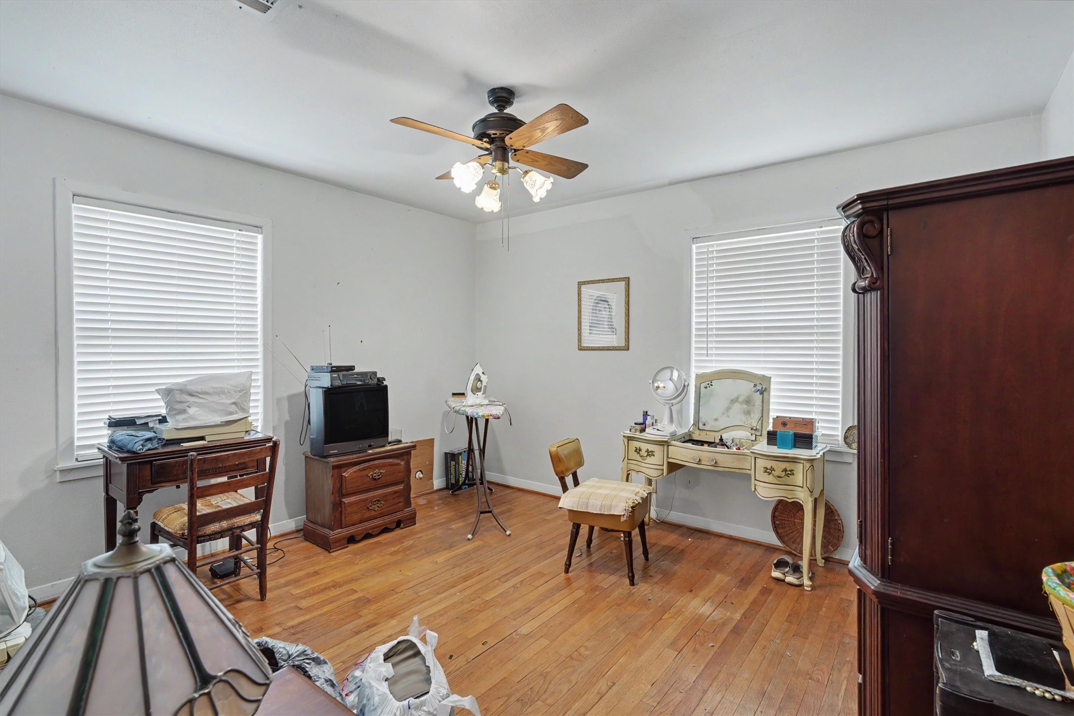 7833 Almeda Genoa Road Houston, TX 77075 - Photo 11 of 21 a living room with furniture a piano and a flat screen tv