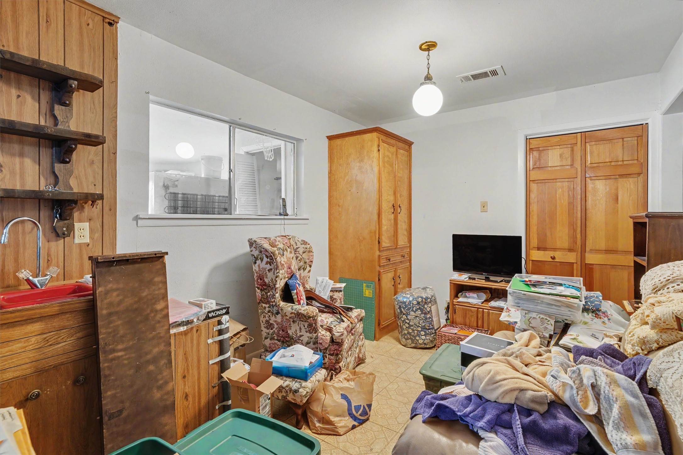 7833 Almeda Genoa Road Houston, TX 77075 - Photo 6 of 21 a living room with furniture a rug and a flat screen tv
