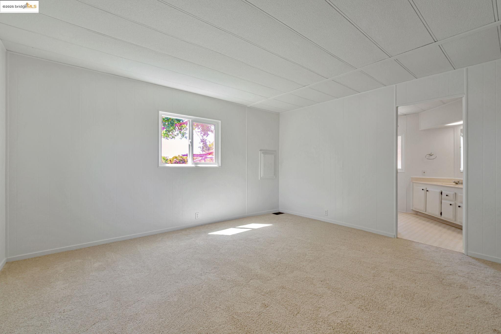 4603 Balfour Road, Unit 58 Brentwood, CA 94513 - Photo 17 of 33 a view of an empty room with a window