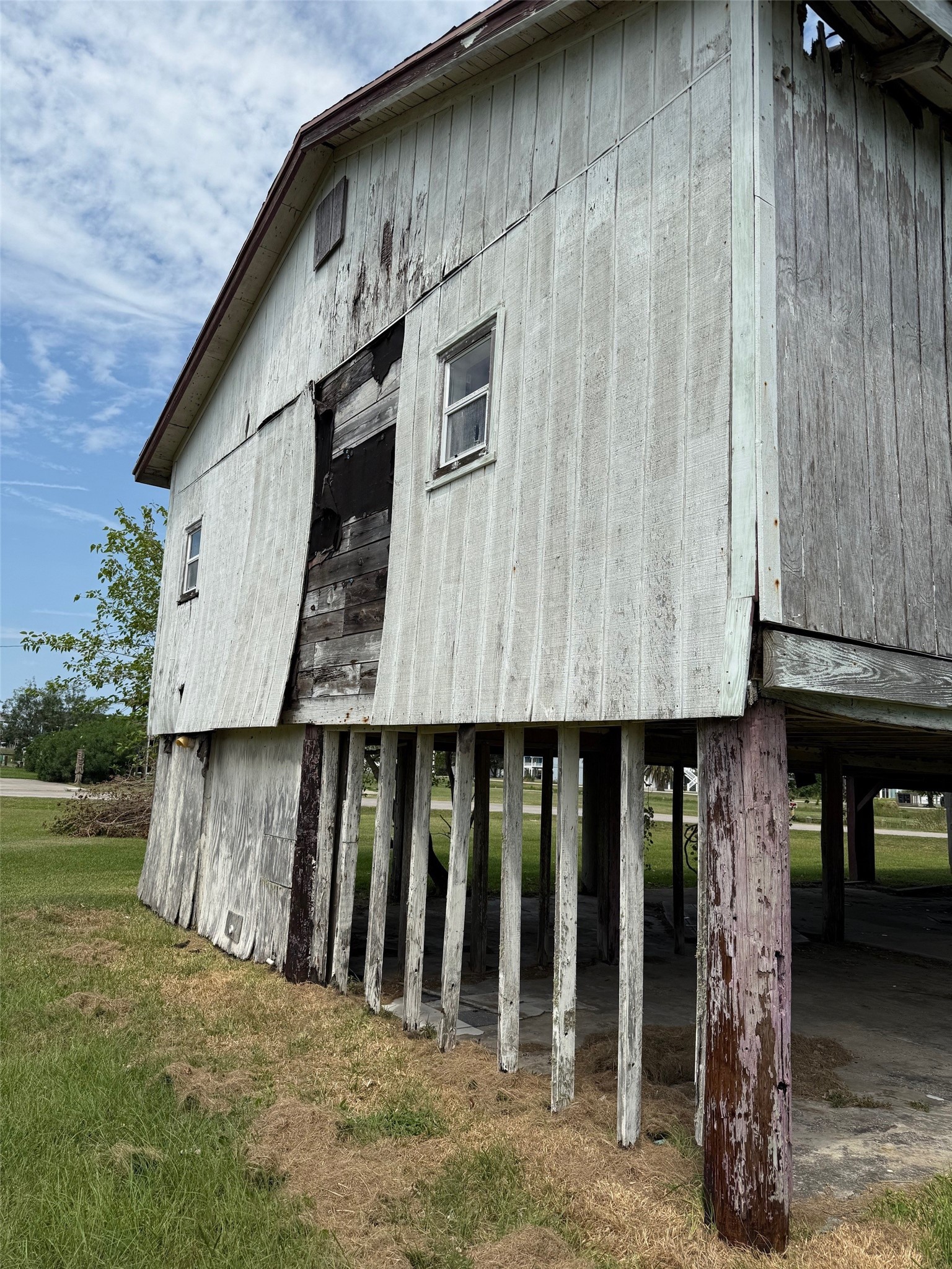 1067 E Road Crystal Beach, TX 77650 - Photo 4 of 4 a view of a house with wooden fence