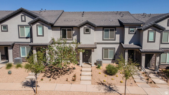 1693 Devils Gdn Lane Washington, UT 84780 - Photo 2 of 64 Multi-story stucco exterior featuring stone accents and dark trim