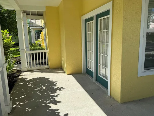 a view of porch with a door
