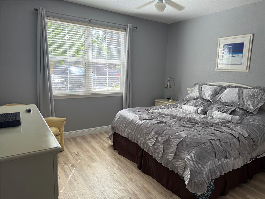 3006 Bonfire Beach Drive, Unit 102 Kissimmee, FL 34746 - Photo 10 of 15 a bed sitting in a bedroom next to a window