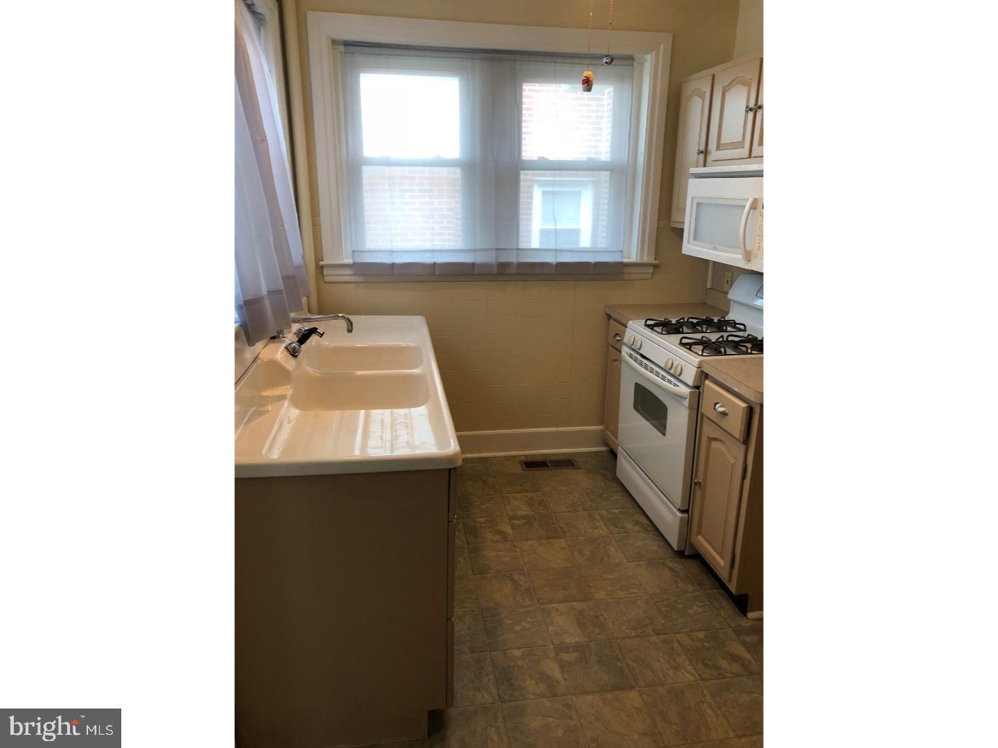 209 Ash Road Wallingford, PA 19086 - Photo 6 of 15 A quaint and bright kitchen