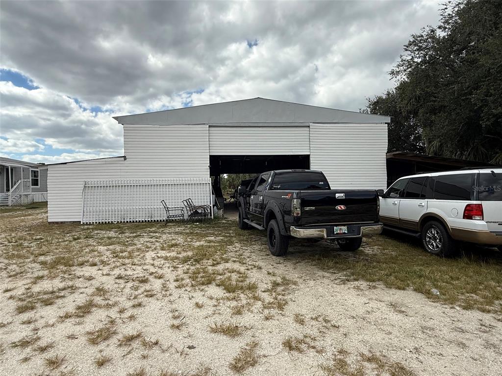 15628 Northwest 310th Street Okeechobee, FL 34972 - Photo 12 of 39 a view of a car in garage