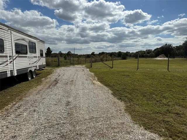 a view of a lake with a big yard