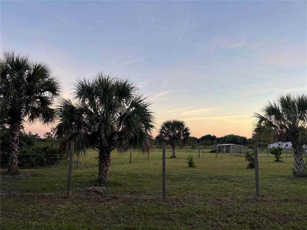 15628 Northwest 310th Street Okeechobee, FL 34972 - Photo 20 of 39 a view of a lake with a big yard