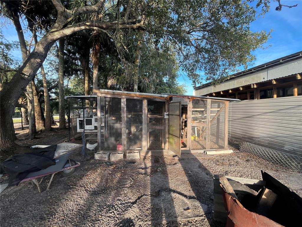 15628 Northwest 310th Street Okeechobee, FL 34972 - Photo 21 of 39 a view of backyard with deck and outdoor seating