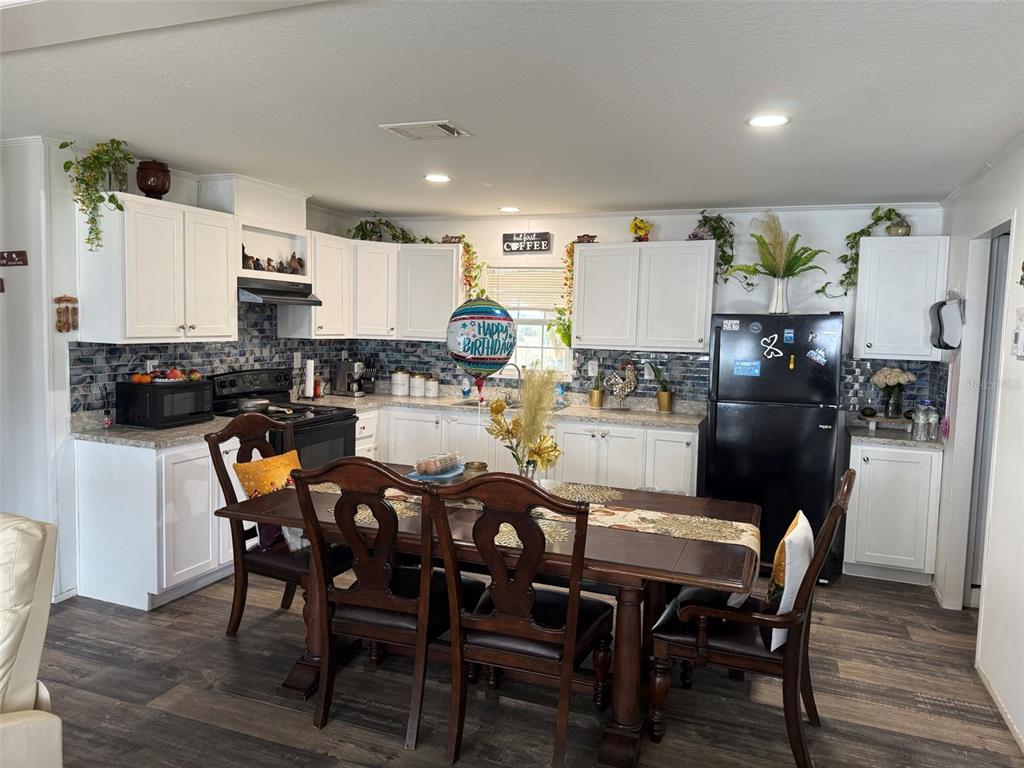 15628 Northwest 310th Street Okeechobee, FL 34972 - Photo 3 of 39 a view of a dining room with furniture