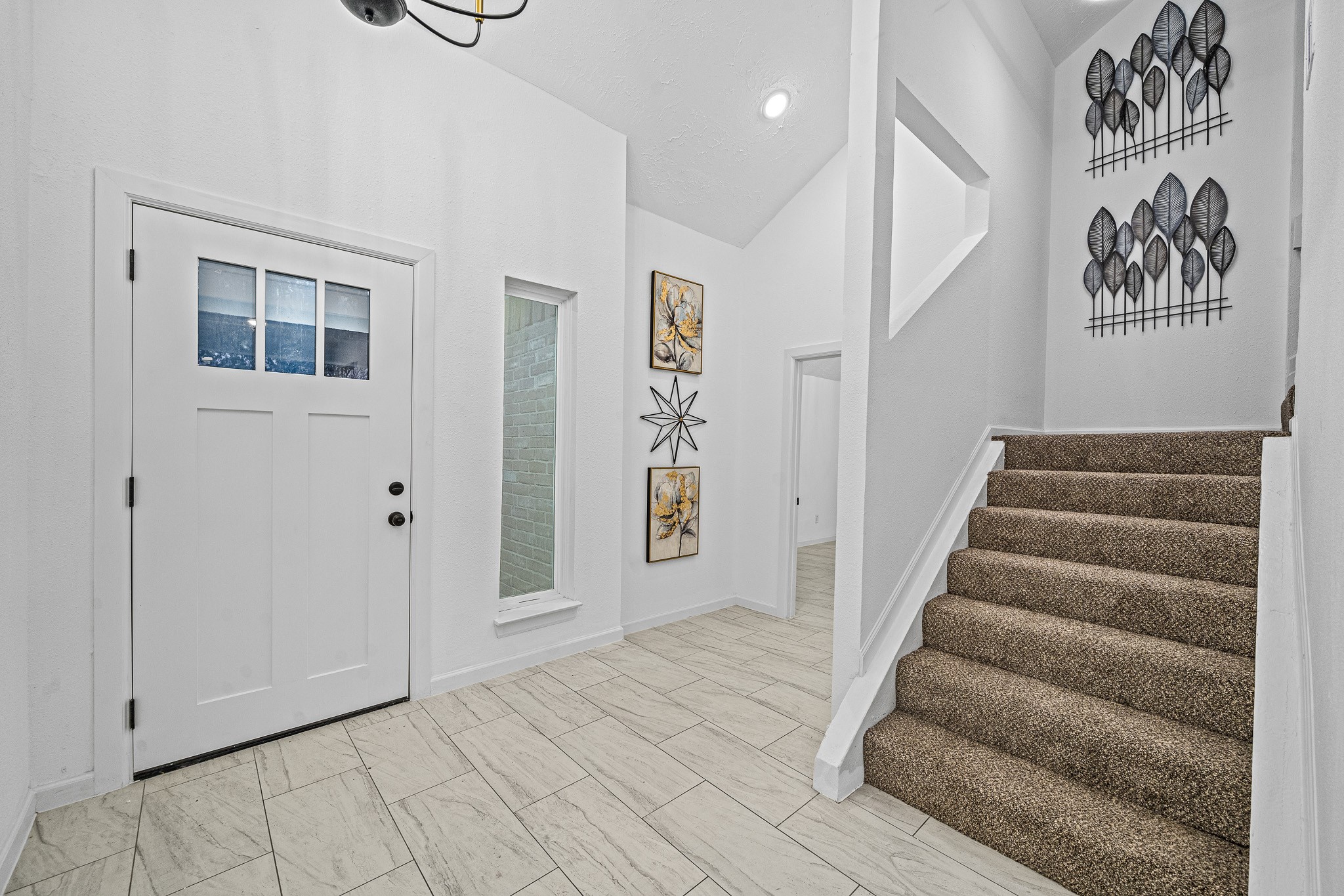 6706 Trigate Drive Houston, TX 77489 - Photo 11 of 40 a view of entryway with stairs and wooden floor