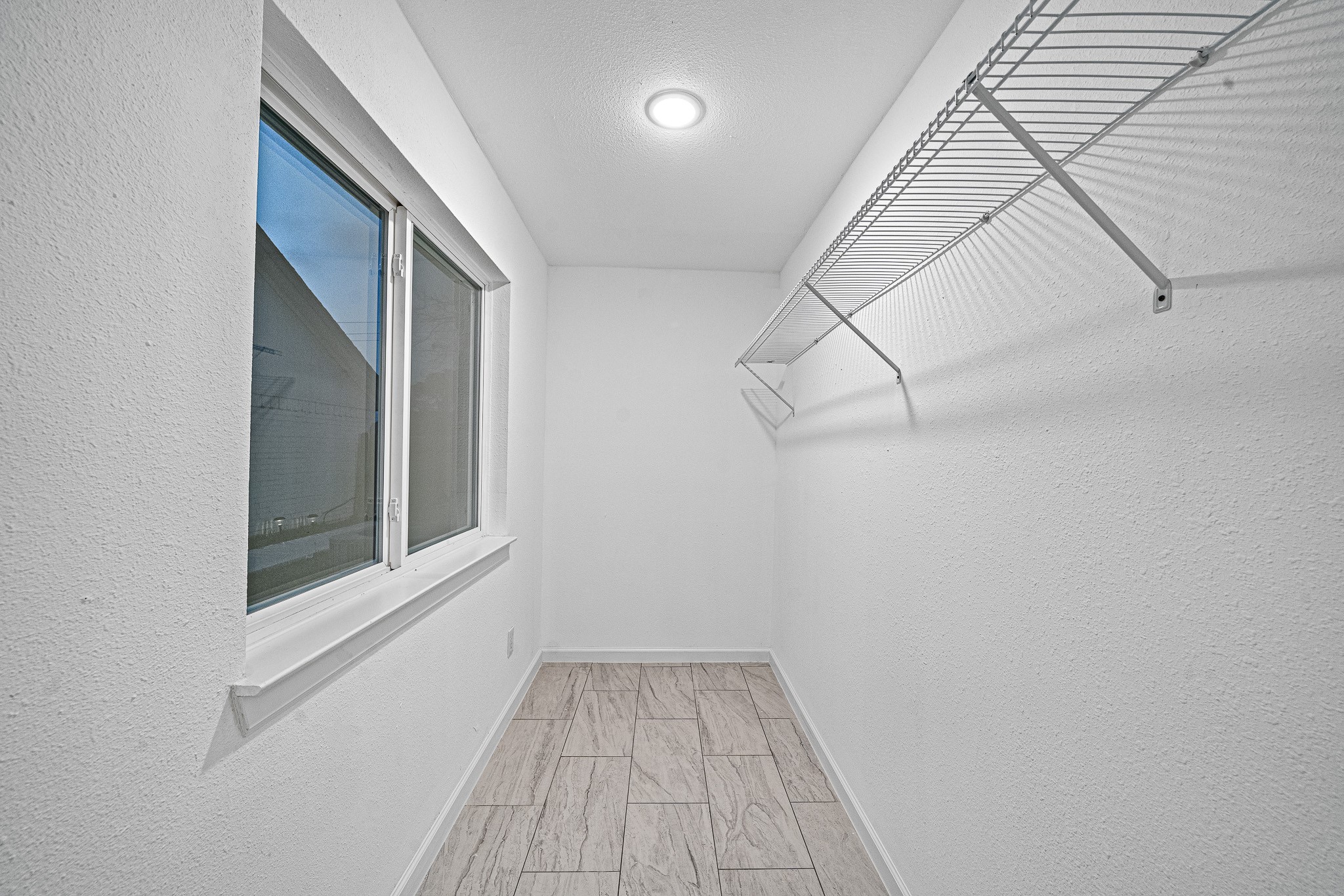 6706 Trigate Drive Houston, TX 77489 - Photo 14 of 40 a view of a room with racks on the wall