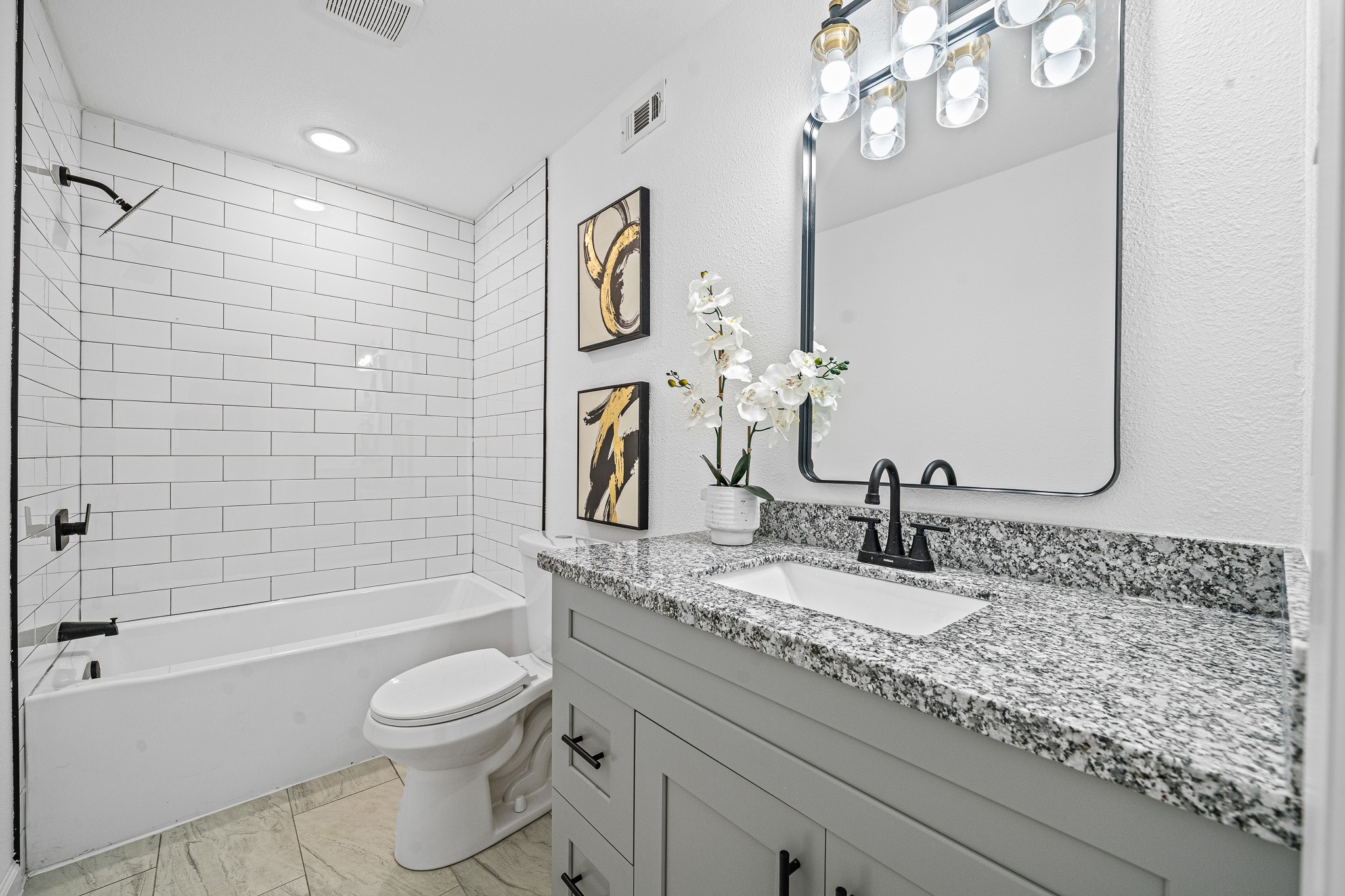 6706 Trigate Drive Houston, TX 77489 - Photo 15 of 40 a bathroom with a granite countertop sink a toilet and bathtub