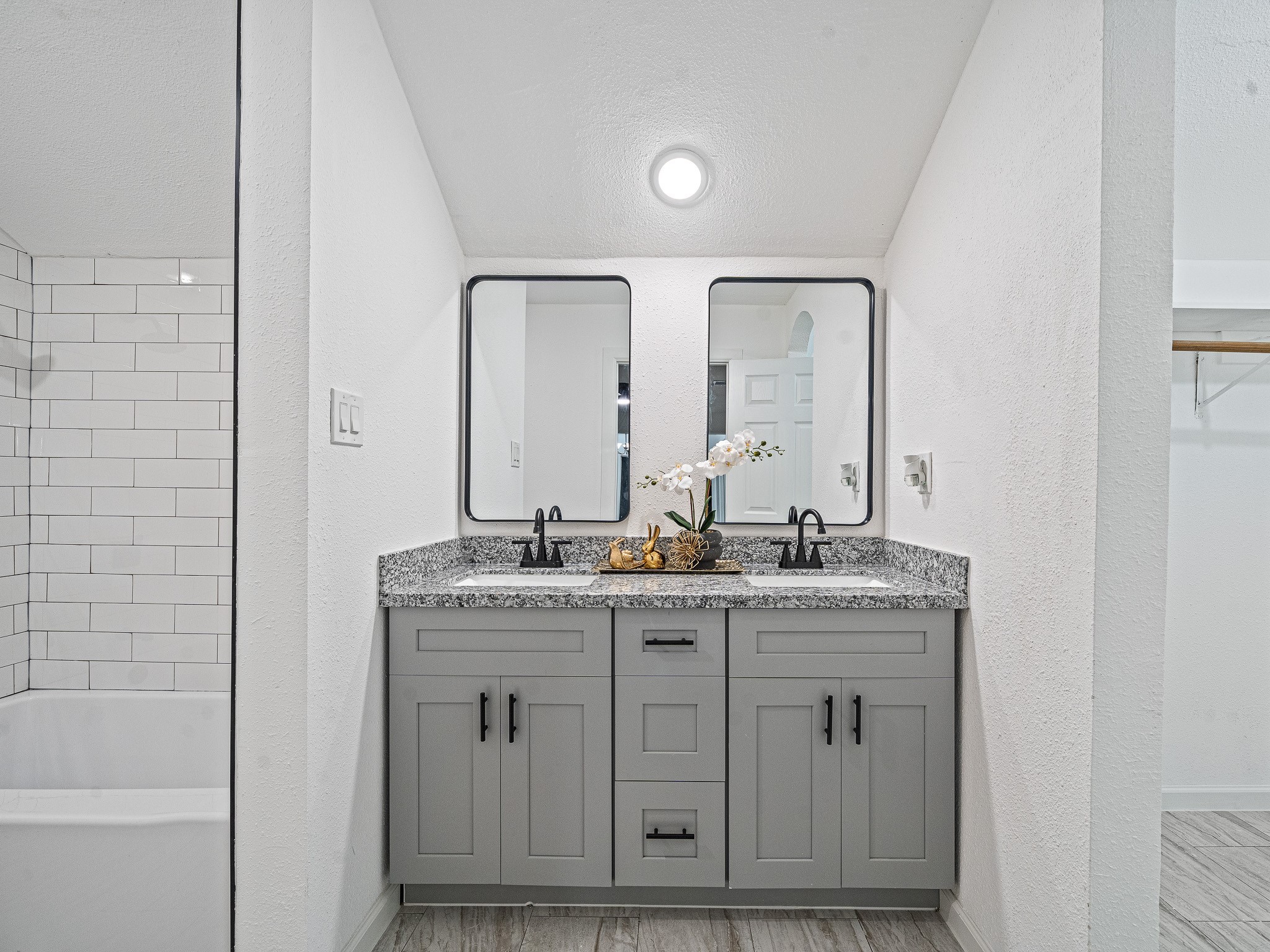 6706 Trigate Drive Houston, TX 77489 - Photo 37 of 40 a en suite bathroom with a granite countertop sink and a mirror