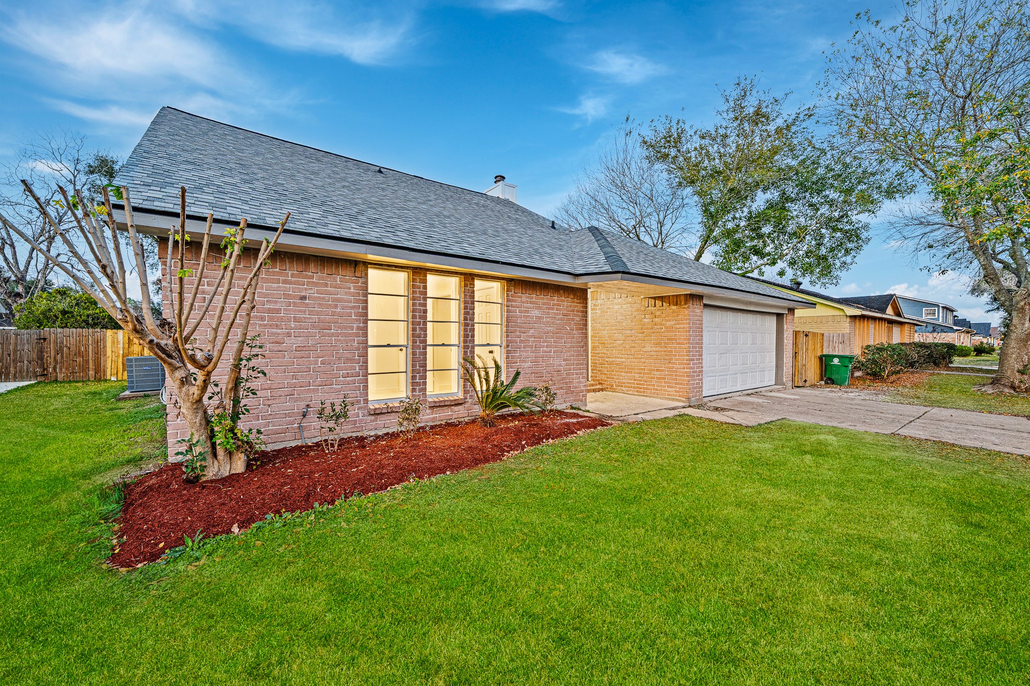 6706 Trigate Drive Houston, TX 77489 - Photo 7 of 40 a front view of a house with a yard porch and outdoor seating