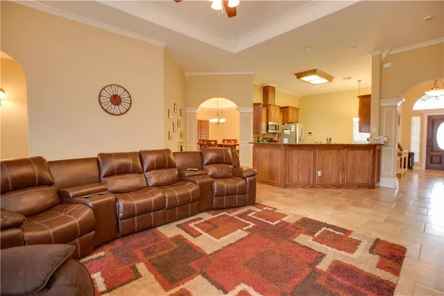 a living room with a couch and a table with wooden floor