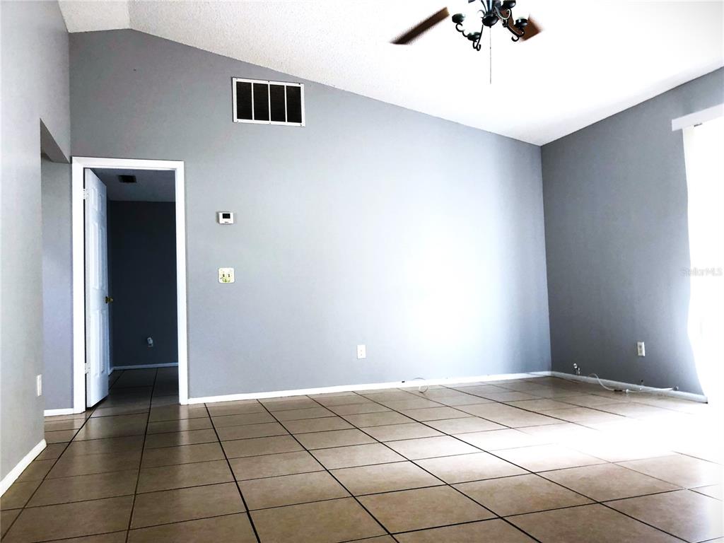 603 Alton Road Winter Springs, FL 32708 - Photo 2 of 8 a view of a livingroom with a flesh screen
