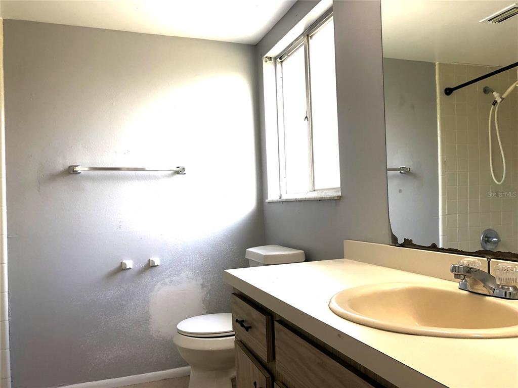 603 Alton Road Winter Springs, FL 32708 - Photo 4 of 8 a bathroom with a sink and a mirror