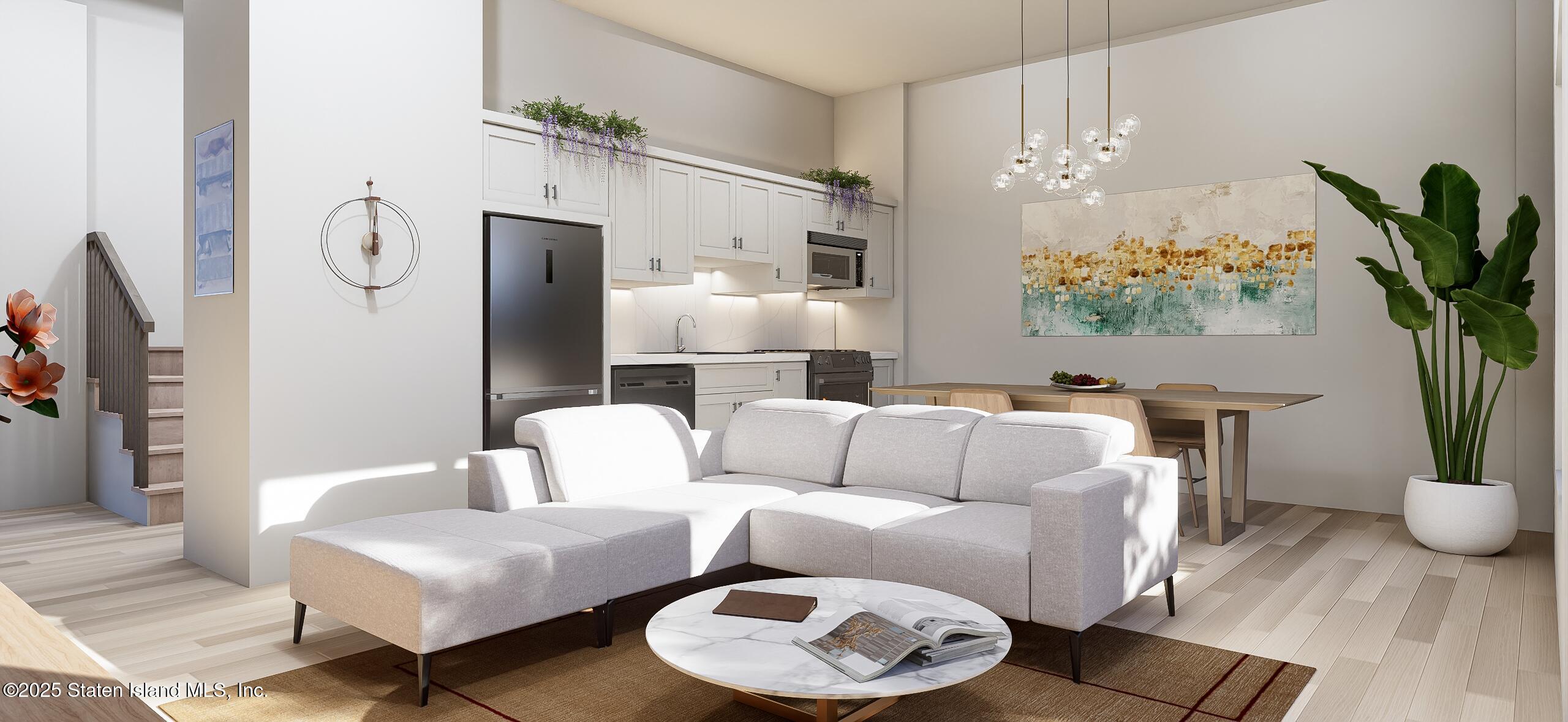 1239 Forest Hill Road, Unit 6 Staten Island, NY 10314 - Photo 3 of 15 a living room with furniture and a chandelier