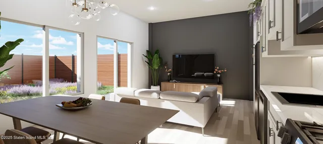 a living room with furniture fireplace and a large window