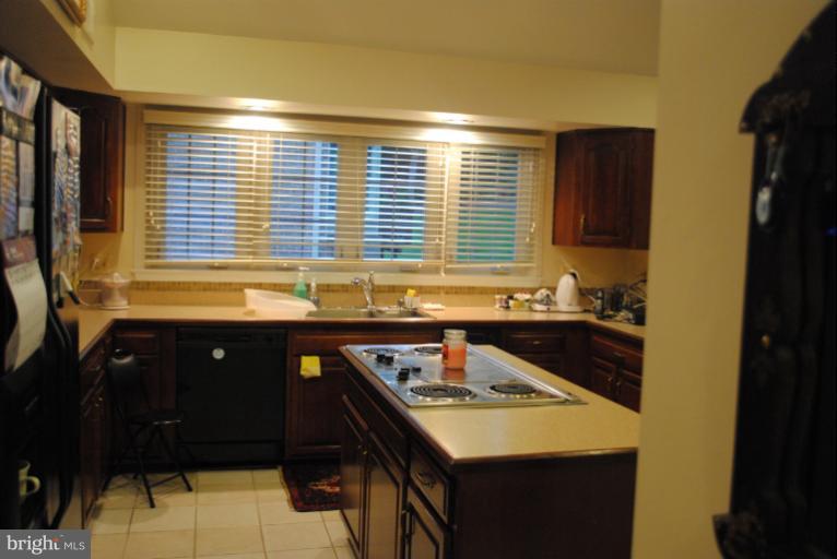 9711 Middleton Ridge Road Vienna, VA 22182 - Photo 14 of 28 a kitchen with a sink and a window