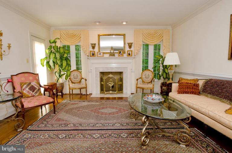 9711 Middleton Ridge Road Vienna, VA 22182 - Photo 22 of 28 a living room with furniture and a fireplace