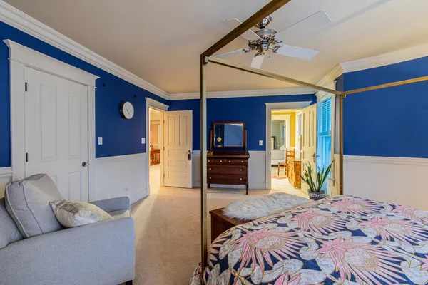 a bedroom with a bed and a dresser