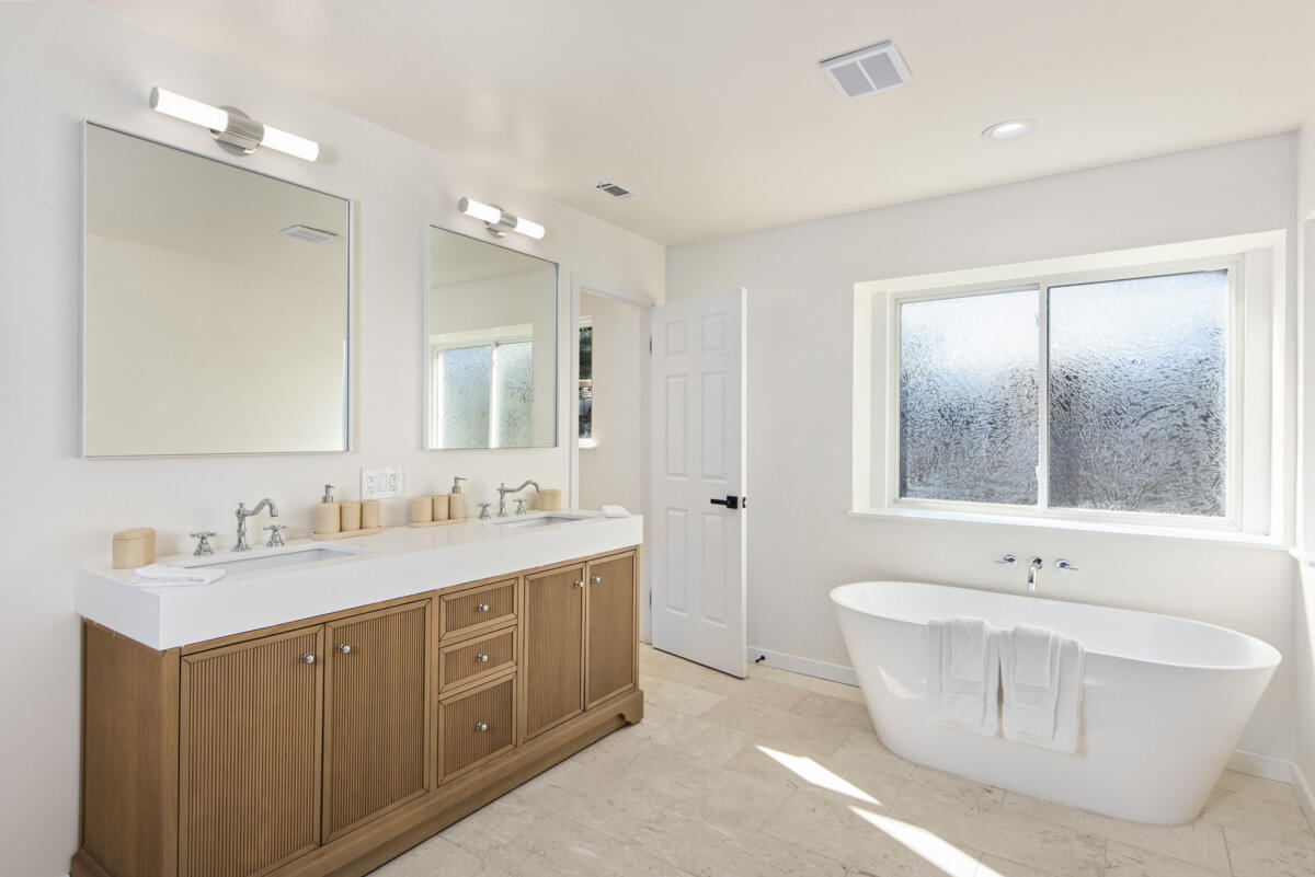 681 Daniel Drive Santa Maria, CA 93454 - Photo 12 of 26 a bathroom with a tub sink double vanity and mirror