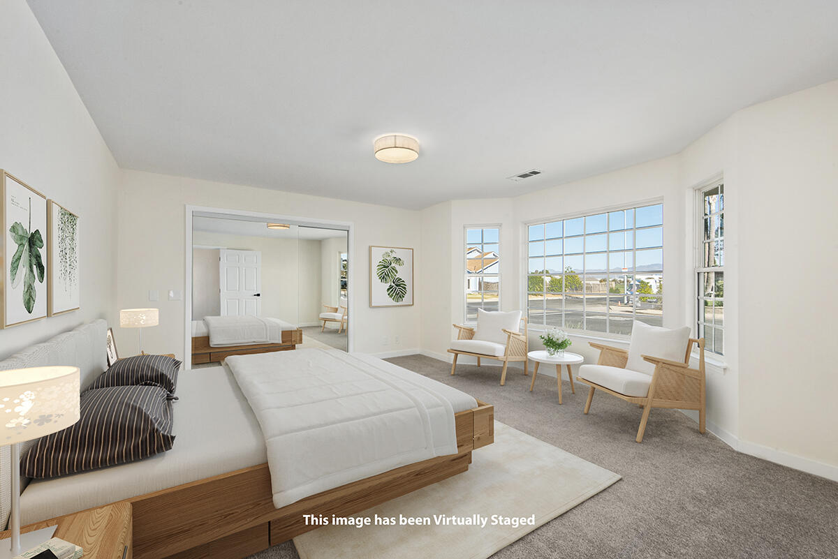 681 Daniel Drive Santa Maria, CA 93454 - Photo 15 of 26 a bedroom with a bed and a large window