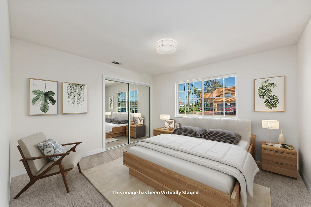 681 Daniel Drive Santa Maria, CA 93454 - Photo 16 of 26 a bedroom with a bed and wooden floor