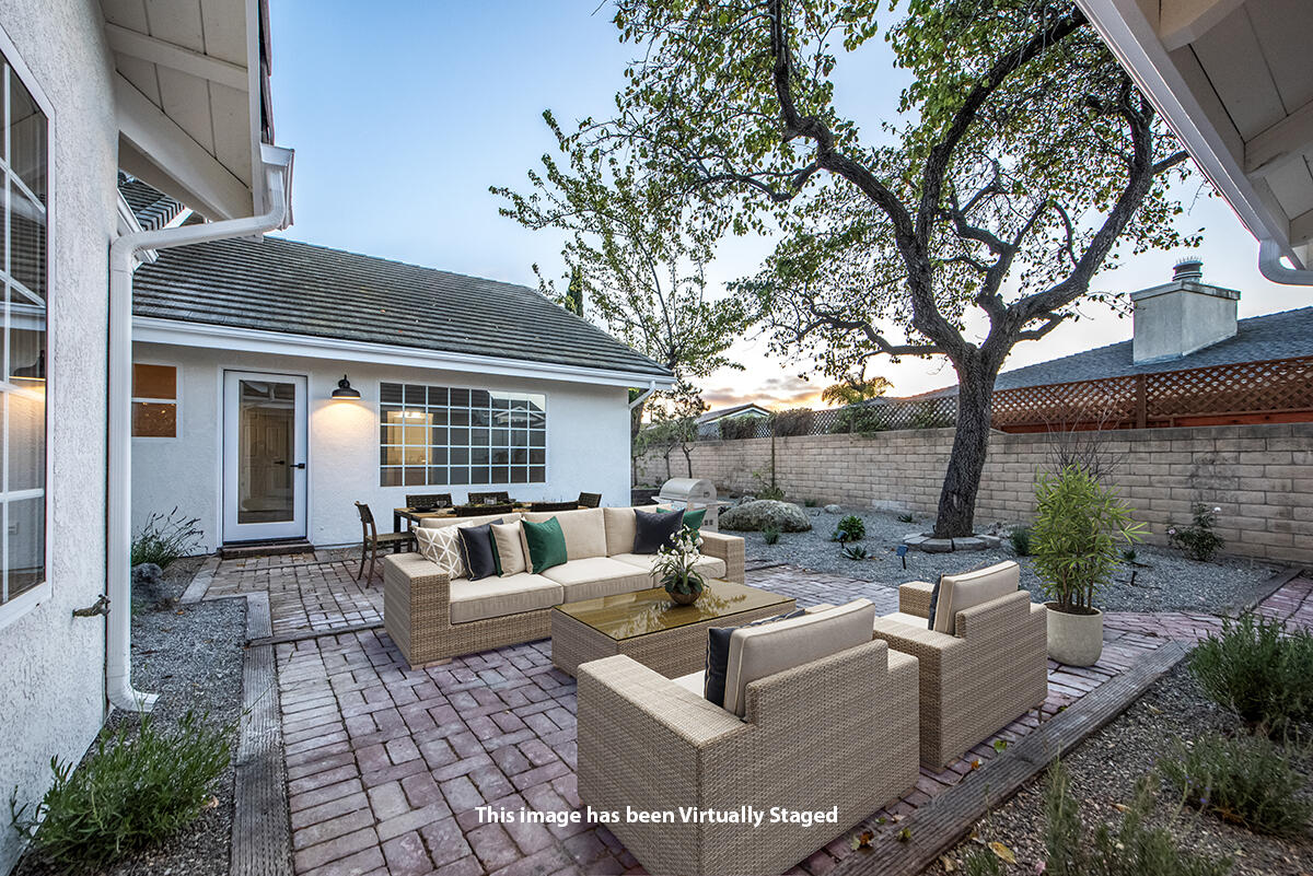 681 Daniel Drive Santa Maria, CA 93454 - Photo 23 of 26 a view of a patio with couches table and chairs and potted plants