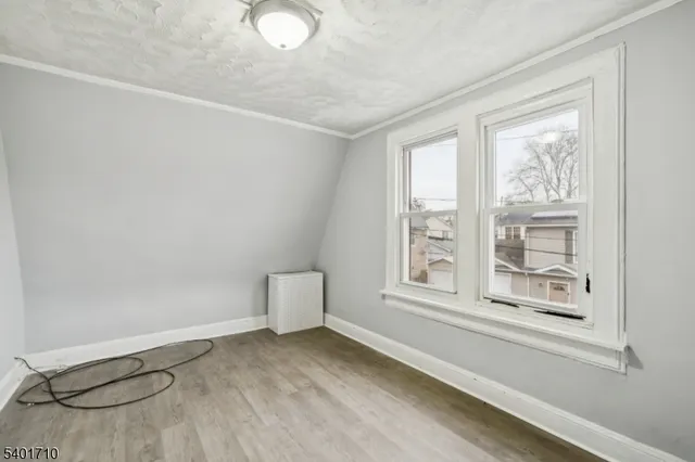 a view of a livingroom with an empty space and a window