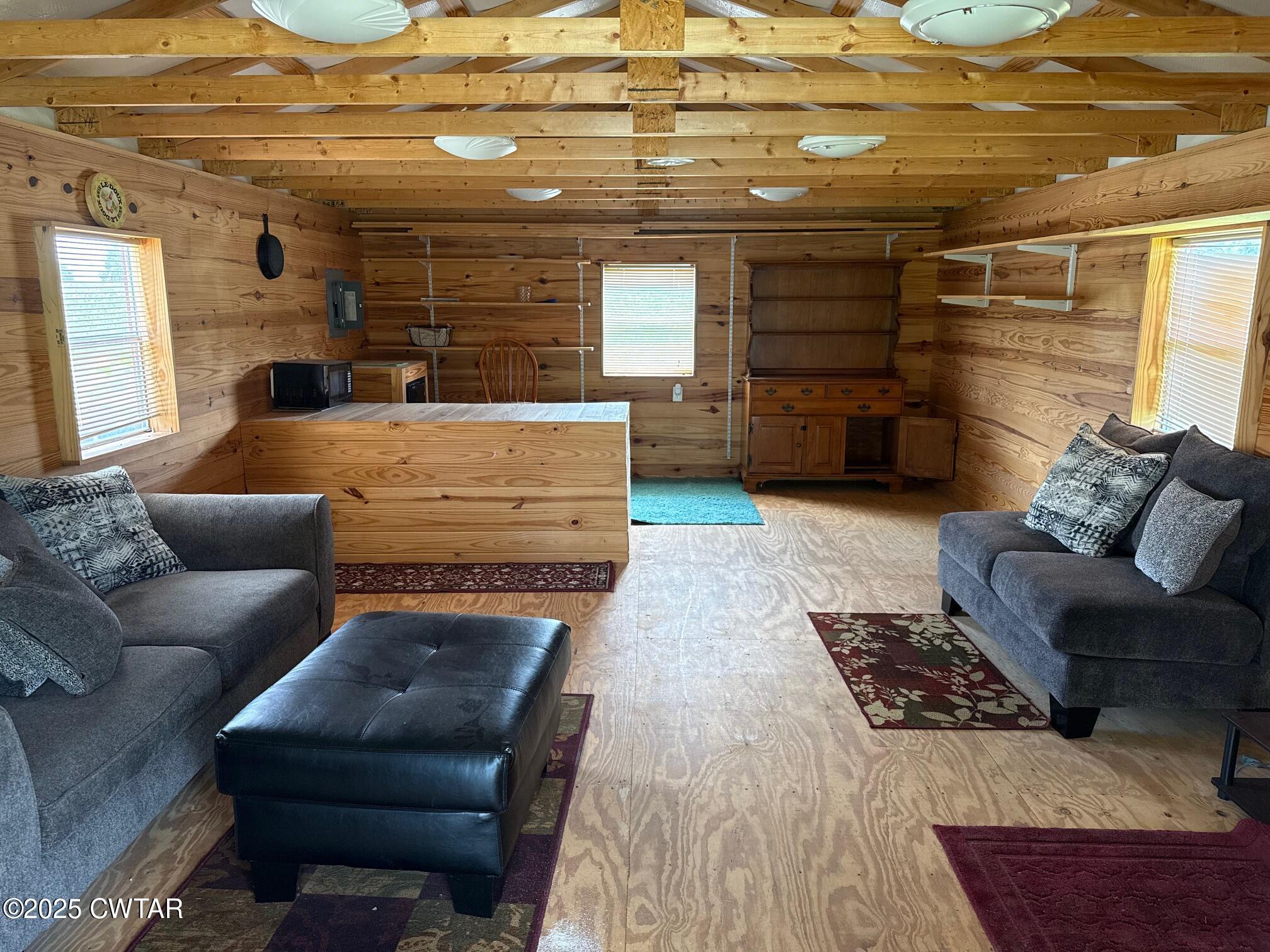 860 Plainview Road Henderson, TN 38340 - Photo 3 of 10 a living room with furniture and a rug