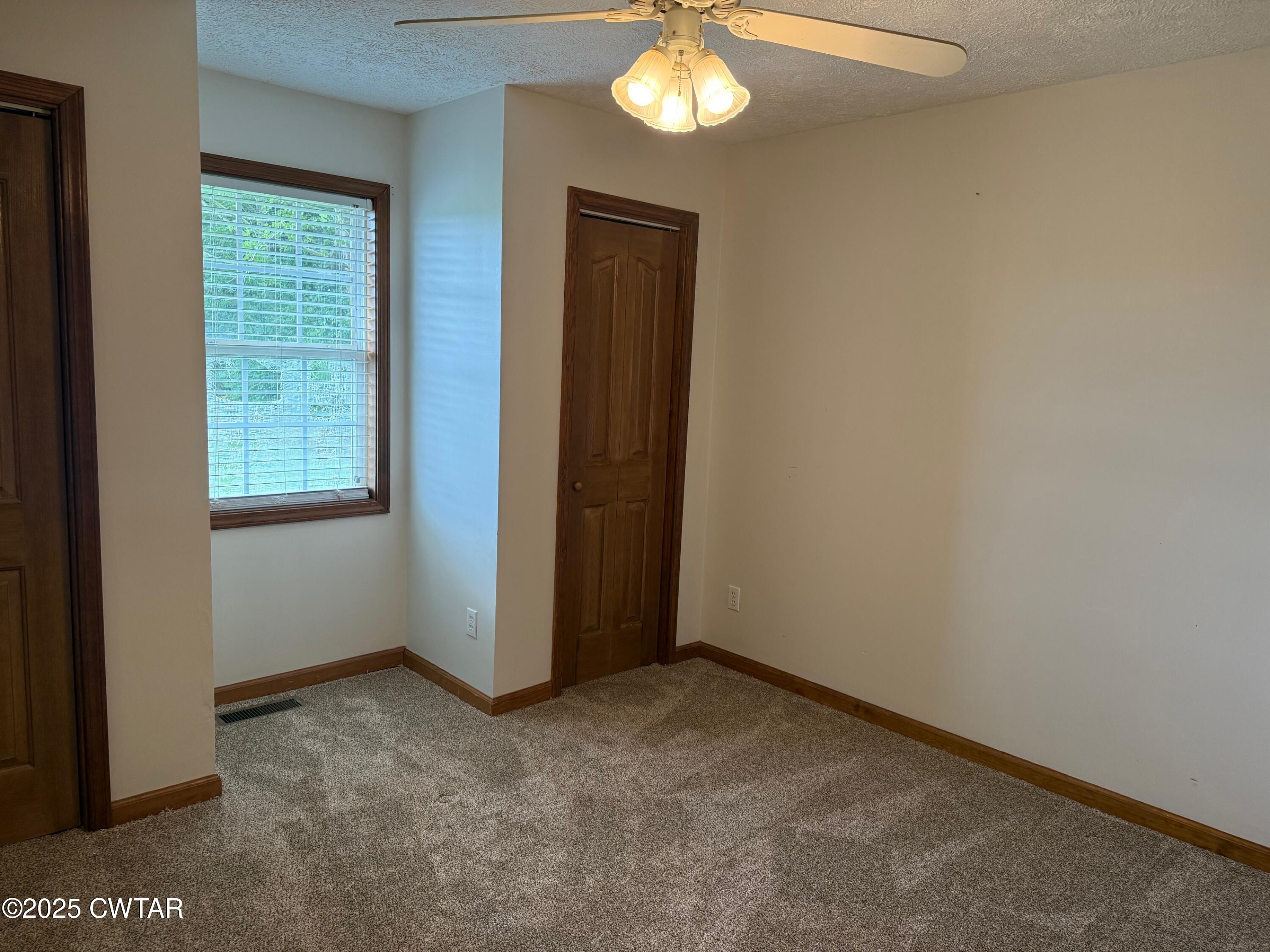 860 Plainview Road Henderson, TN 38340 - Photo 7 of 10 a view of an empty room with a window