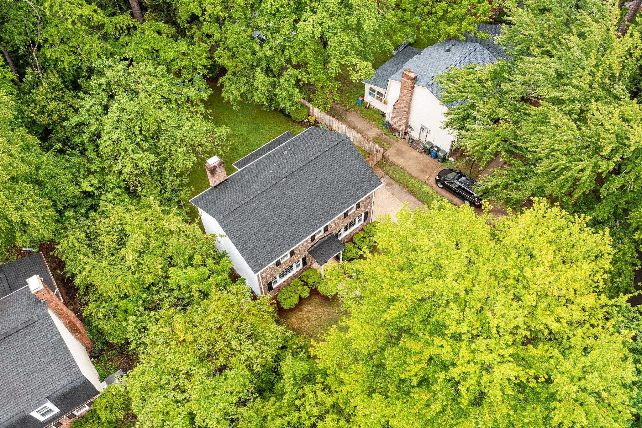 5209 Cedarwood Drive Raleigh, NC 27609 - Photo 32 of 33 a backyard of a house with lots of green space