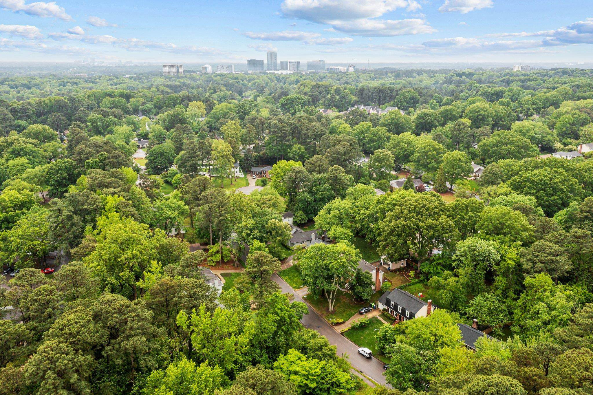5209 Cedarwood Drive Raleigh, NC 27609 - Photo 33 of 33 an aerial view of houses with yard