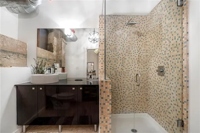 a bathroom with a sink and mirror