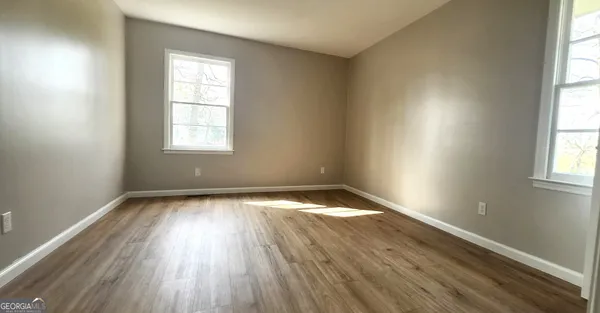 a view of an empty room and window