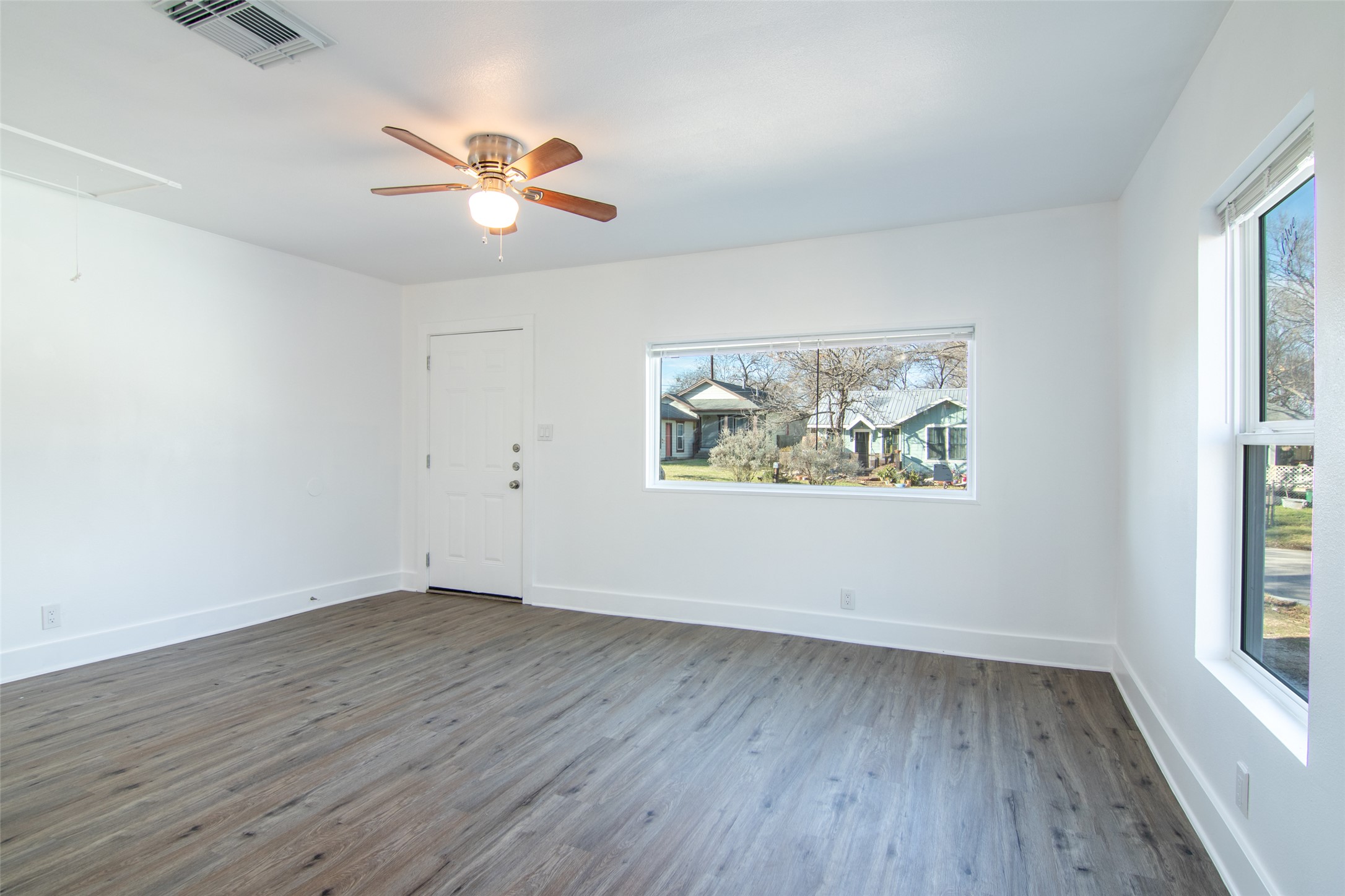 3203 East 16th Street Austin, TX 78721 - Photo 6 of 21 Another view of the living space and front entry.