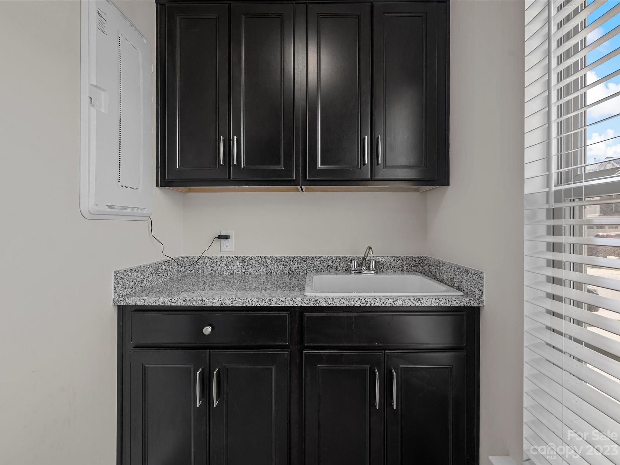 3071 Hartson Pointe Drive Indian Land, SC 29707 - Photo 20 of 48 a kitchen with granite countertop wood cabinets