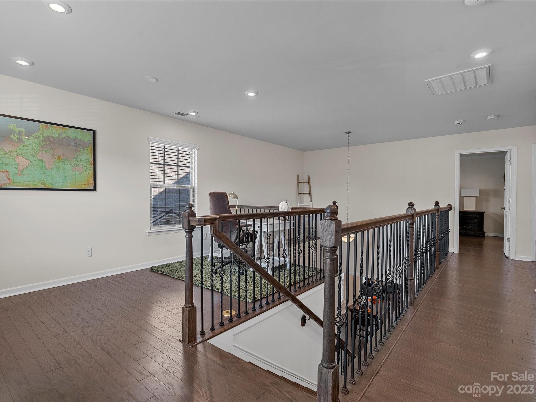 3071 Hartson Pointe Drive Indian Land, SC 29707 - Photo 21 of 48 a view of a hallway with wooden floor and windows