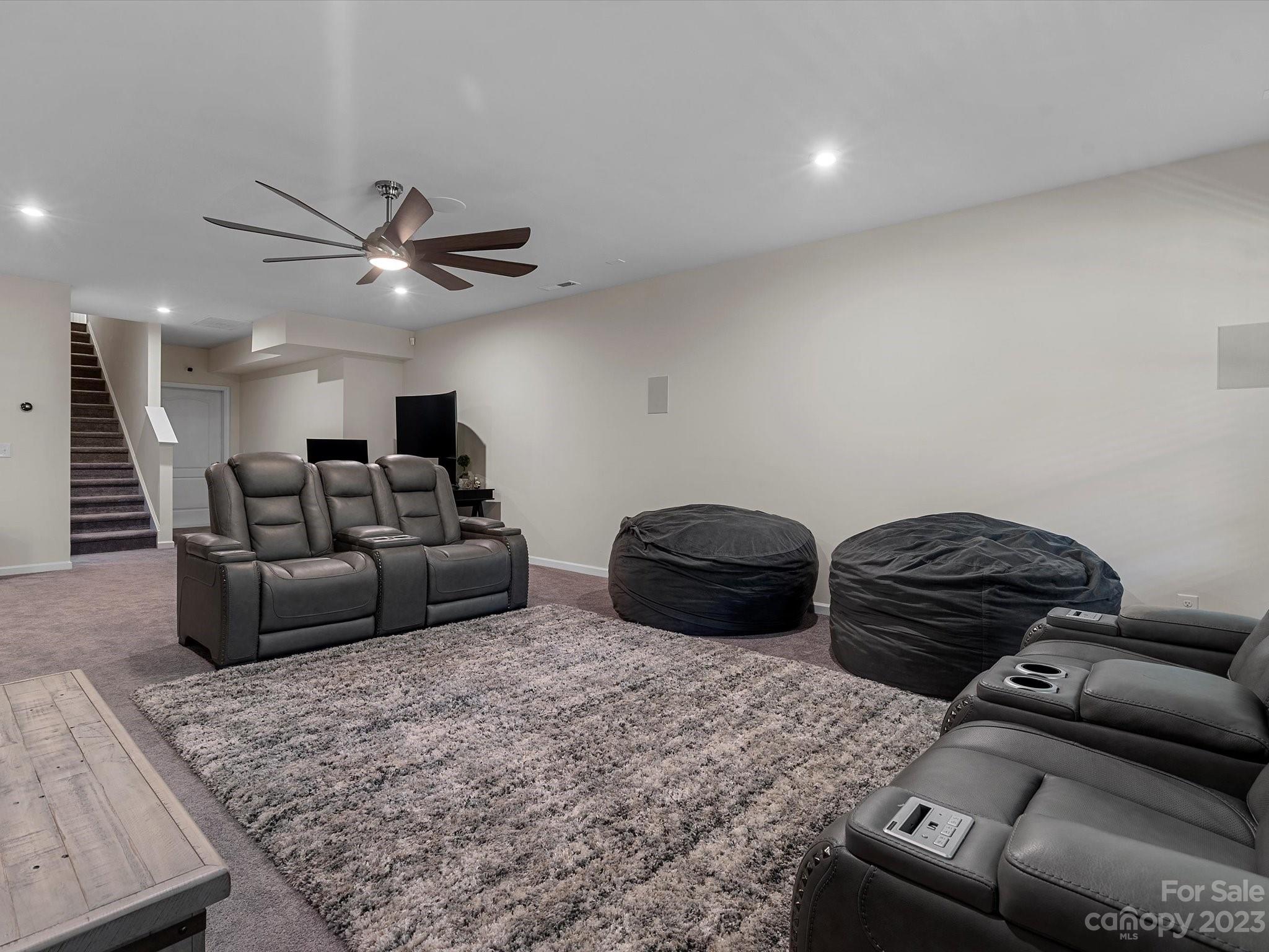 3071 Hartson Pointe Drive Indian Land, SC 29707 - Photo 39 of 48 a living room with furniture and a ceiling fan
