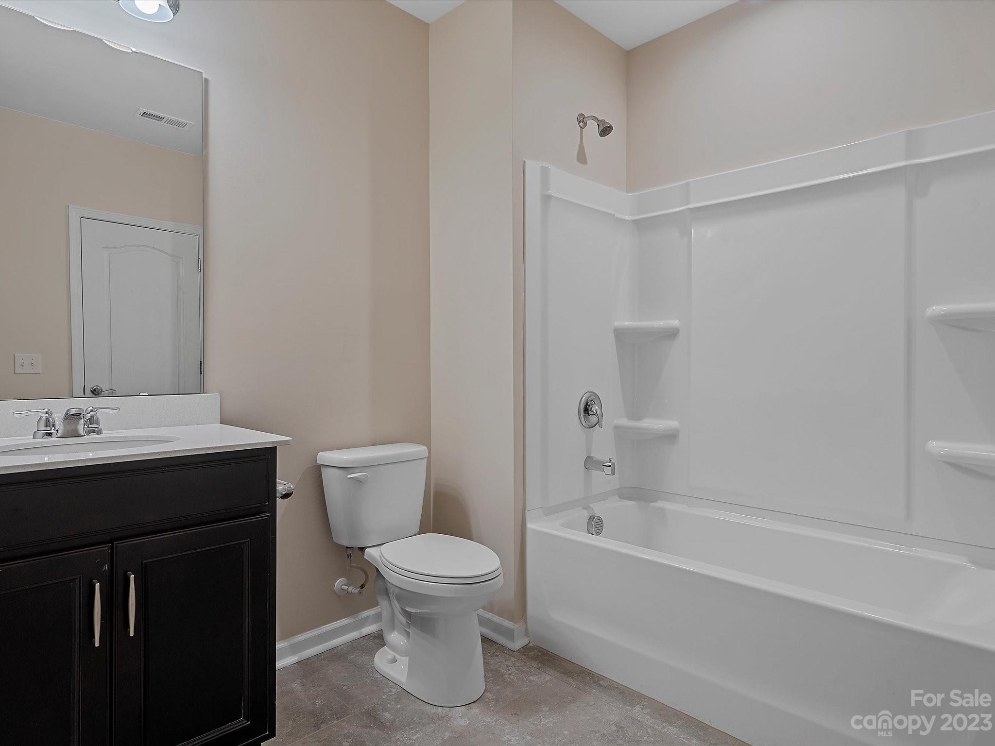 3071 Hartson Pointe Drive Indian Land, SC 29707 - Photo 43 of 48 a bathroom with a sink a toilet and shower