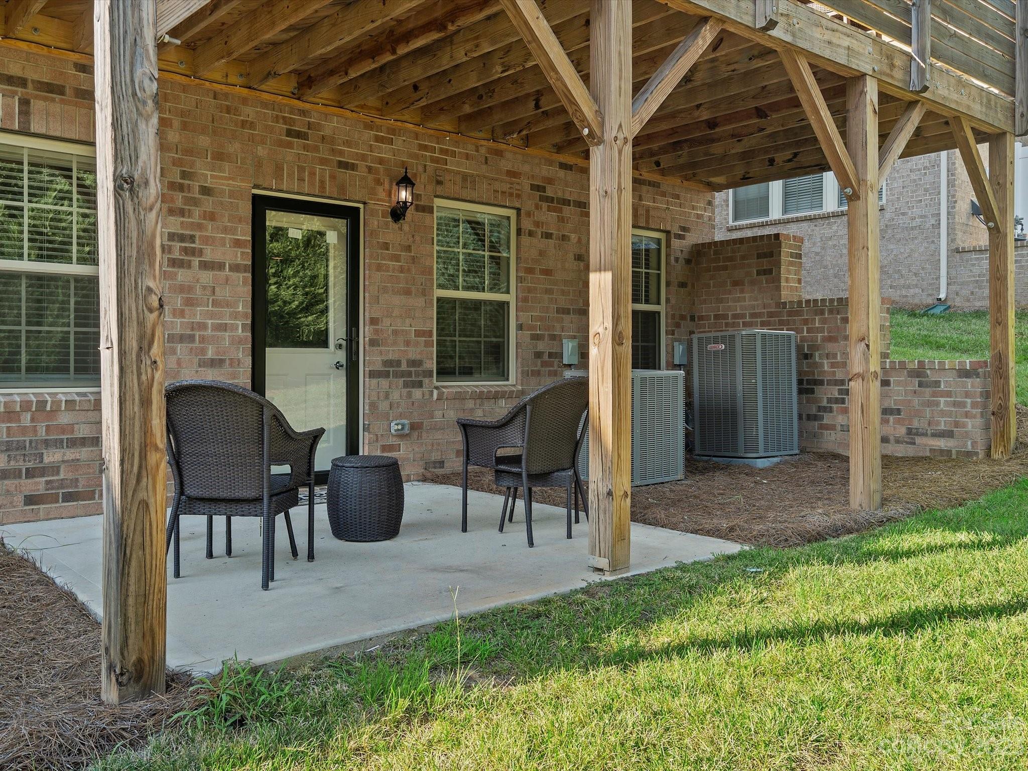 3071 Hartson Pointe Drive Indian Land, SC 29707 - Photo 47 of 48 a view of a patio with table and chairs and potted plants