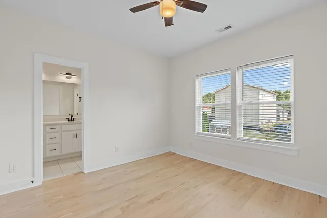 a view of a balcony with wooden floor