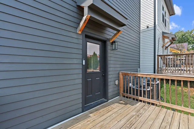 a view of a house with backyard and porch