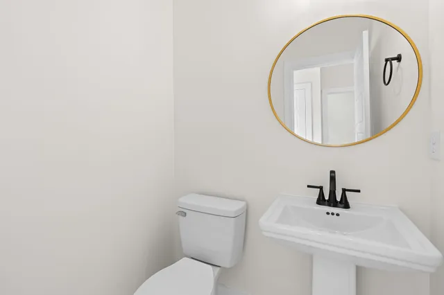 an empty room with a window and a ceiling fan