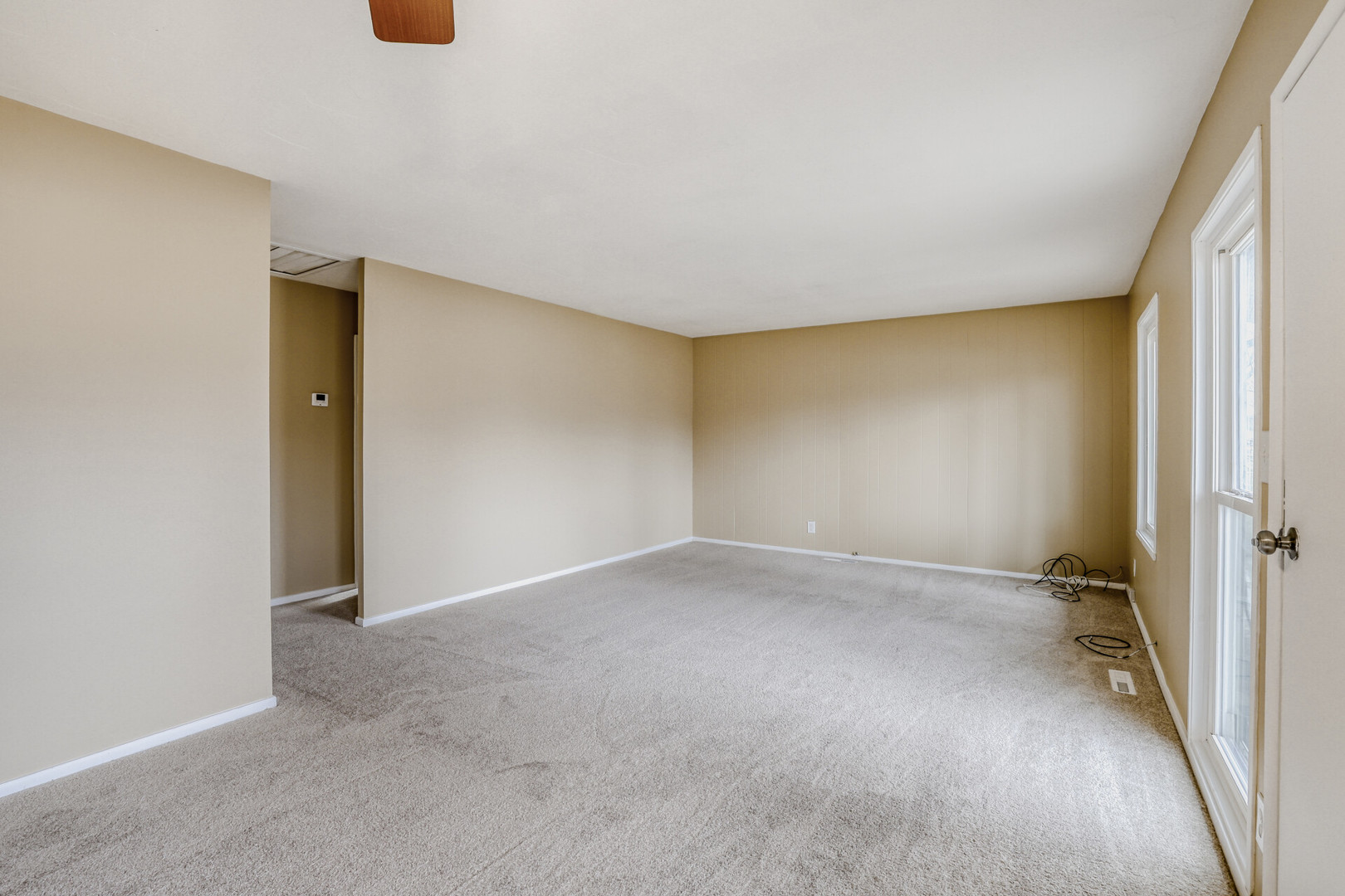 17 South Bartlett Road Streamwood, IL 60107 - Photo 2 of 16 an empty room with a window